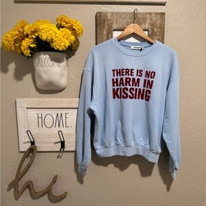 DayDreamer “there is no harm in kissing” sweater new w tags
Size S/M